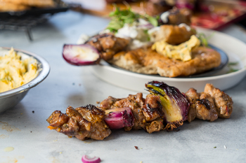 Prego Kebab on Fried Flatbread with Delicious Dressing