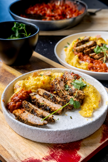 Herb-crusted Pork Chops & Creamy Polenta with spicy tomato relish
