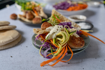 Pork Sausage Meatball Pitas with Shredded Vegetables
